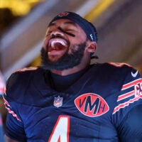 Dec 20, 2025; Chicago, Illinois, USA; Chicago Bears running back D'Andre Swift (4) reacts as he takes the field before the game against the Green Bay Packers at Soldier Field.