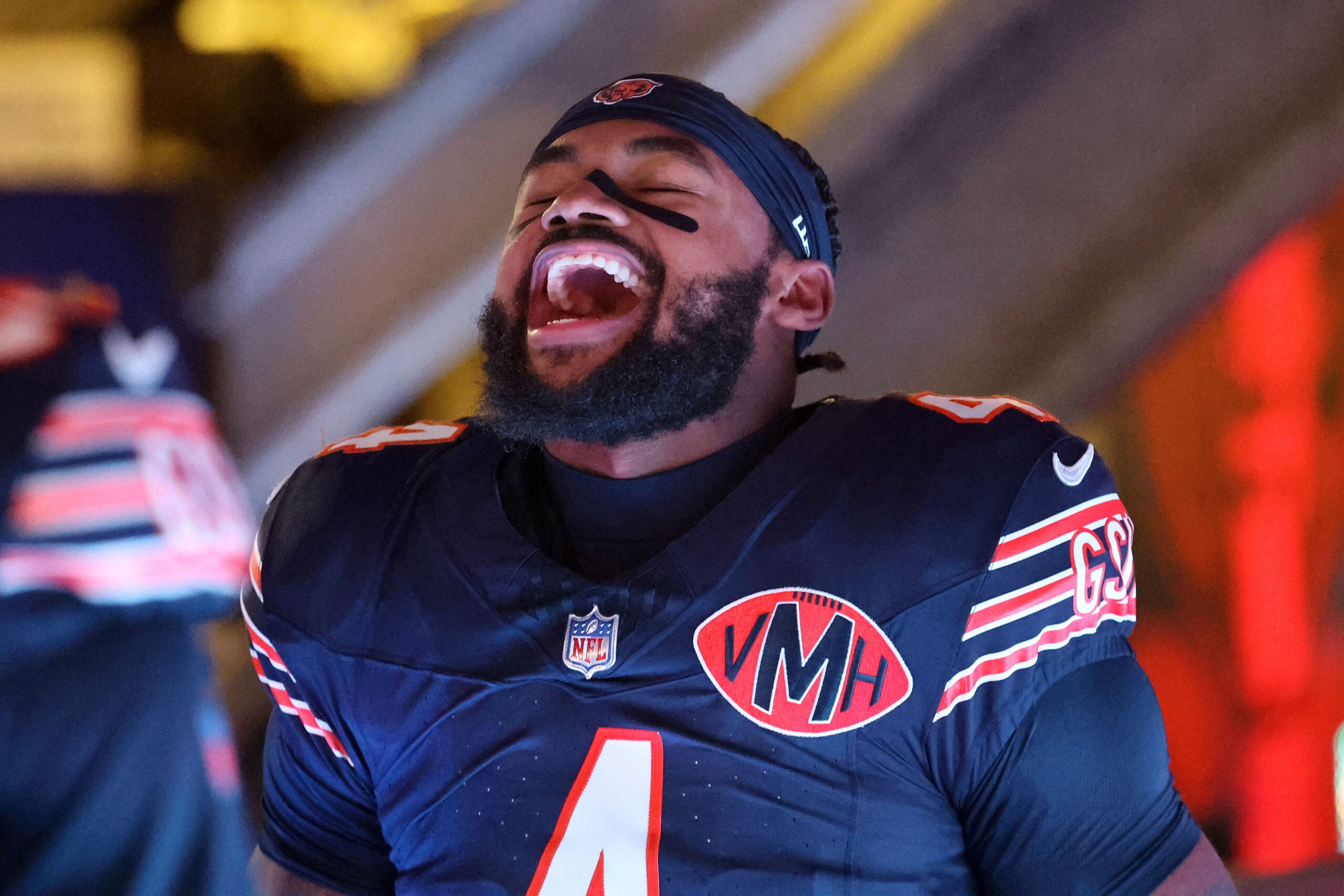 Dec 20, 2025; Chicago, Illinois, USA; Chicago Bears running back D'Andre Swift (4) reacts as he takes the field before the game against the Green Bay Packers at Soldier Field.