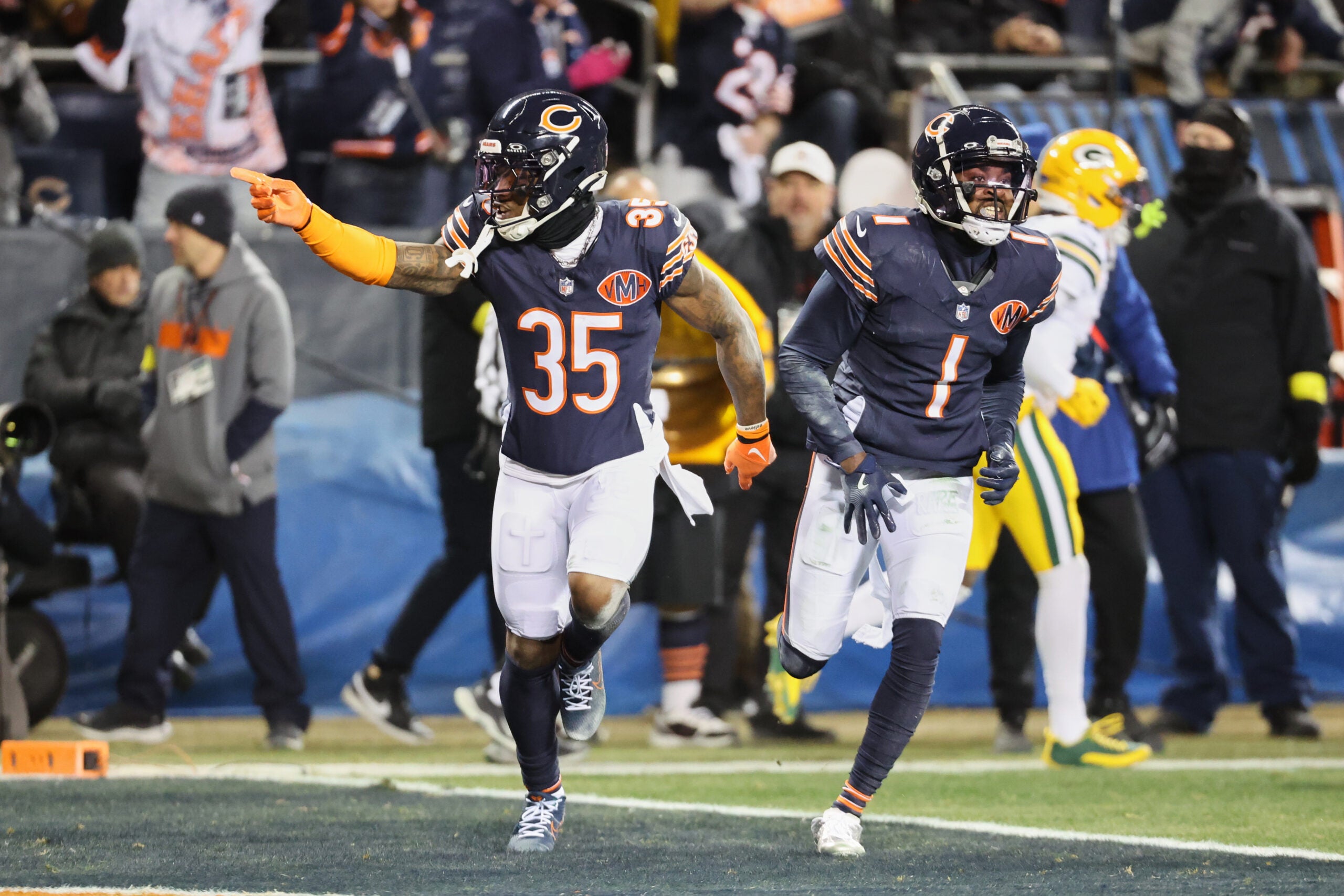 Dec 20, 2025; Chicago, Illinois, USA; Chicago Bears safety C.J. Gardner-Johnson (35) and cornerback Jaylon Johnson (1) acknowledge the crowd against the Green Bay Packers during the first quarter at Soldier Field.