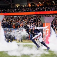 Dec 20, 2025; Chicago, Illinois, USA; Chicago Bears cornerback Nahshon Wright (26) runs onto the field during player introductions before the game against the Green Bay Packers at Soldier Field.