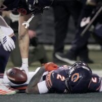 Chicago Bears wide receiver DJ Moore (2) lies on the turf after making the game-winning touchdown catch during overtime in their game Saturday, December 20, 2025 at Soldier Field in Chicago, Illinois. The Chicago Bears beat the Green Bay Packers 22-16 in overtime.