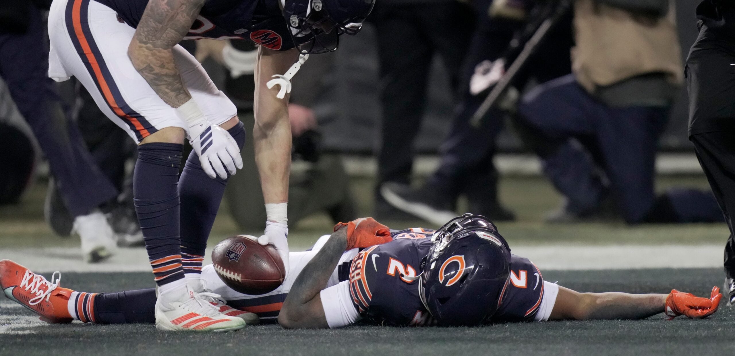 Chicago Bears wide receiver DJ Moore (2) lies on the turf after making the game-winning touchdown catch during overtime in their game Saturday, December 20, 2025 at Soldier Field in Chicago, Illinois. The Chicago Bears beat the Green Bay Packers 22-16 in overtime.