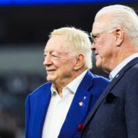 Dec 21, 2025; Arlington, Texas, USA; Dallas Cowboys co-owners Jerry Jones, left, and Stephen Jones, right, stand on the field during pregame warmups against the Los Angeles Chargers at AT&T Stadium.
