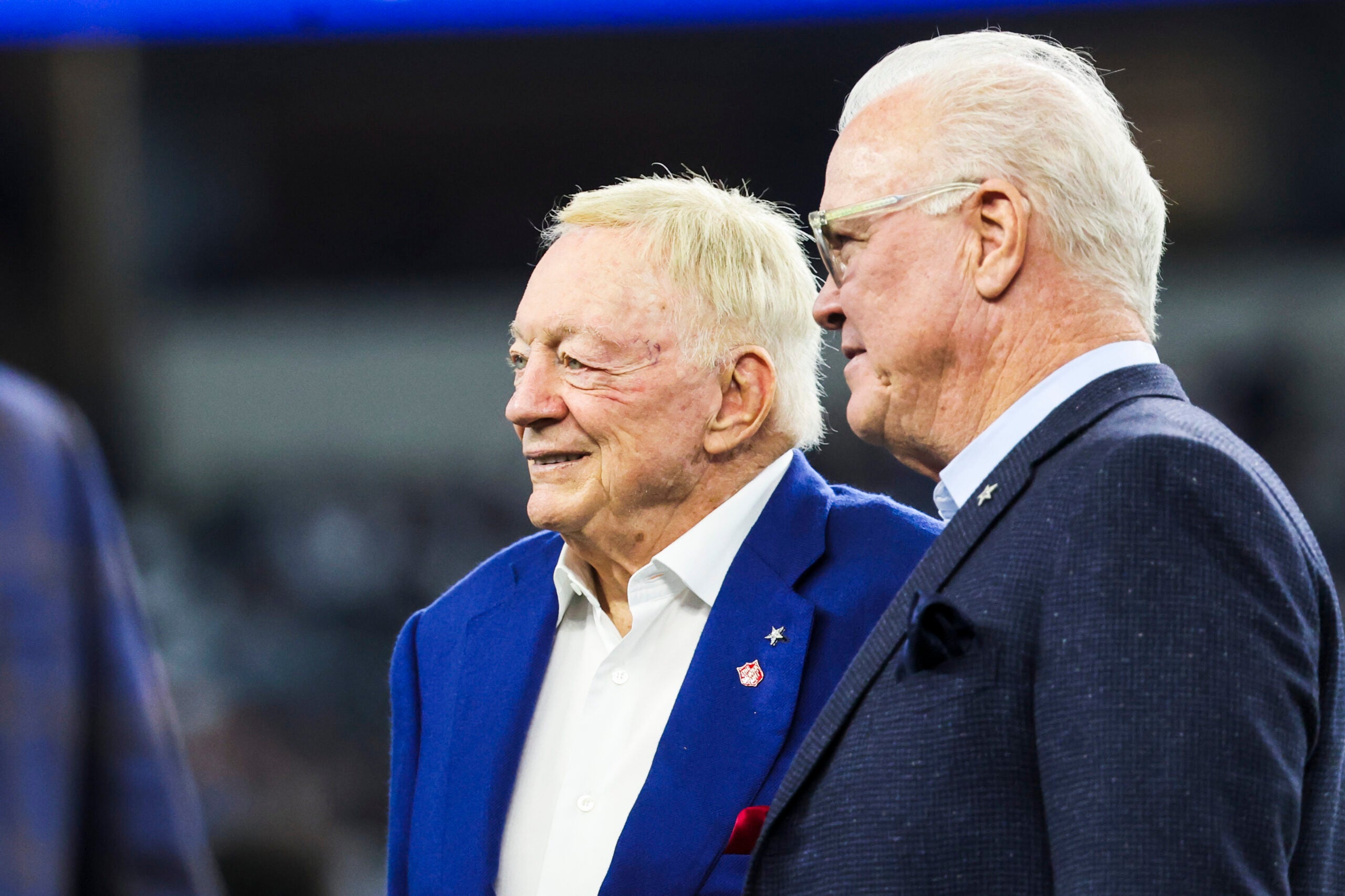 Dec 21, 2025; Arlington, Texas, USA; Dallas Cowboys co-owners Jerry Jones, left, and Stephen Jones, right, stand on the field during pregame warmups against the Los Angeles Chargers at AT&T Stadium.