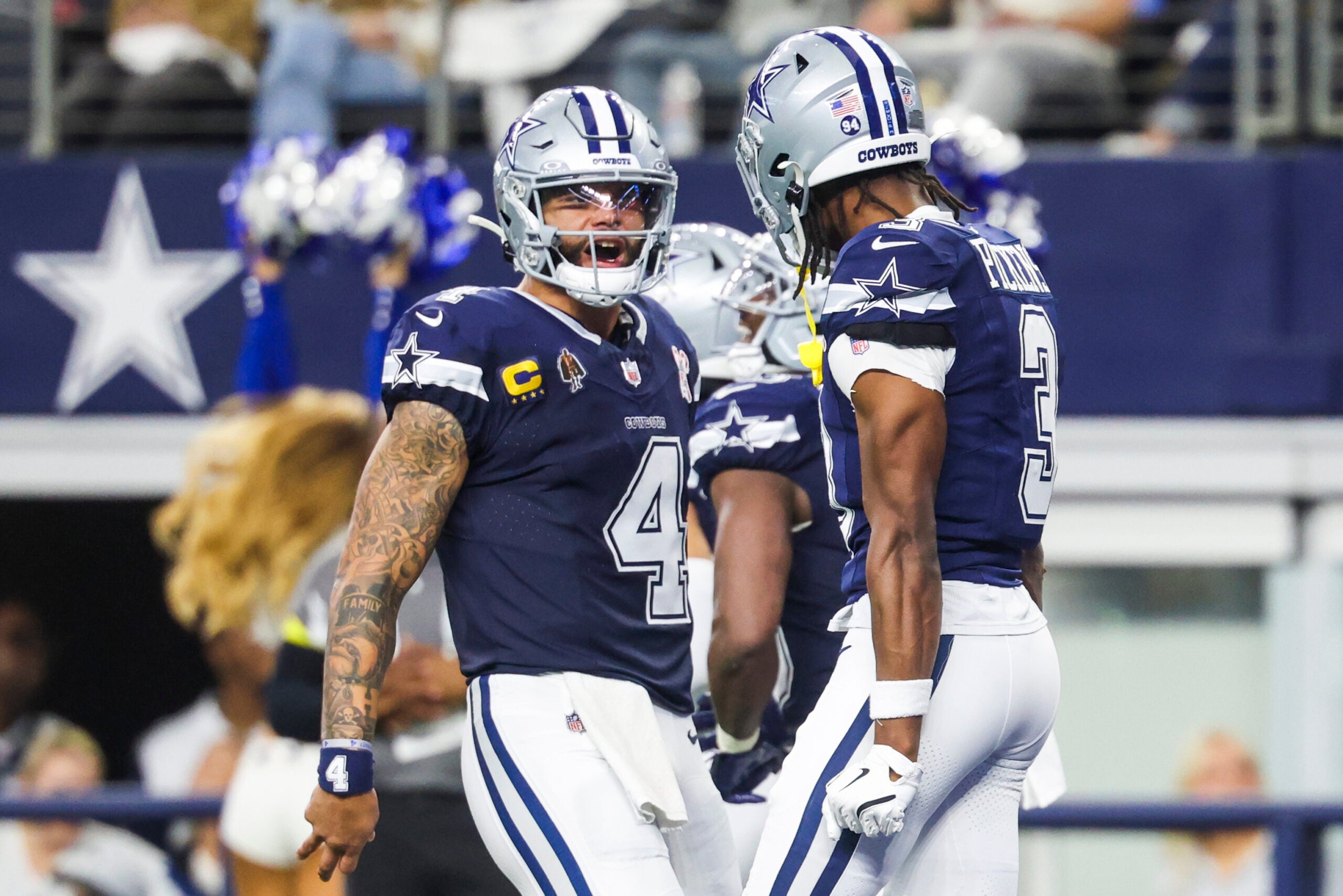 Dec 21, 2025; Arlington, Texas, USA; Dallas Cowboys quarterback Dak Prescott (4) celebrates with wide receiver George Pickens (3) following a touchdown pass caught by Pickens during the second quarter at AT&T Stadium.