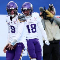 Dec 21, 2025; East Rutherford, New Jersey, USA; Minnesota Vikings quarterback J.J. McCarthy (9) reacts with wide receiver Justin Jefferson (18) after rushing for a touchdown against the New York Giants during the first half at MetLife Stadium.