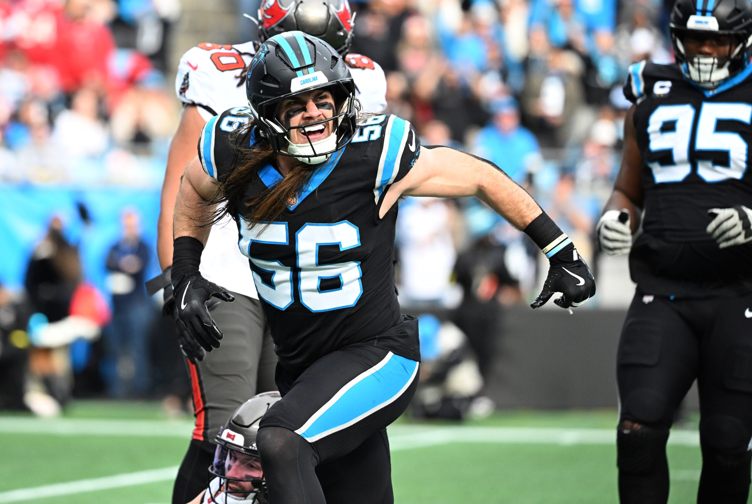 Dec 21, 2025; Charlotte, North Carolina, USA; Carolina Panthers linebacker Christian Rozeboom (56) reacts after sacking Tampa Bay Buccaneers quarterback Baker Mayfield (not pictured) during the first half at Bank of America Stadium.