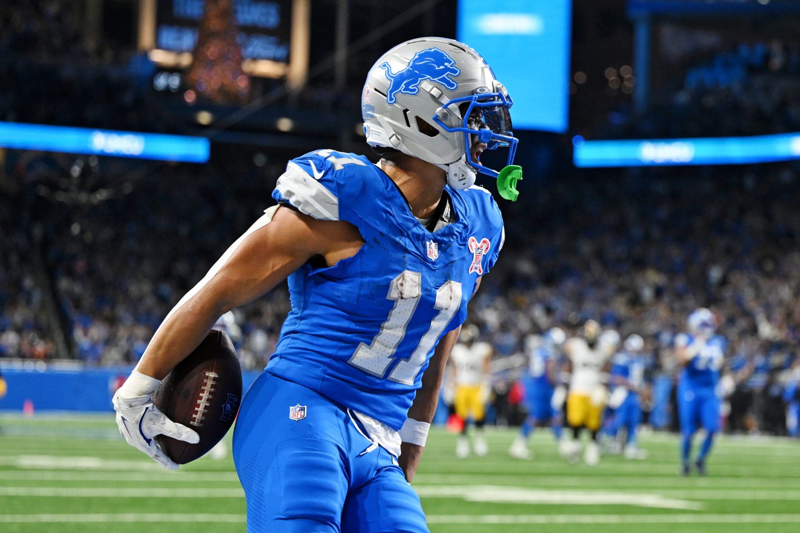 Dec 21, 2025; Detroit, Michigan, USA; Detroit Lions wide receiver Kalif Raymond (11) celebrates after scoring a touchdown during the fourth quarter against the Pittsburgh Steelers at Ford Field.