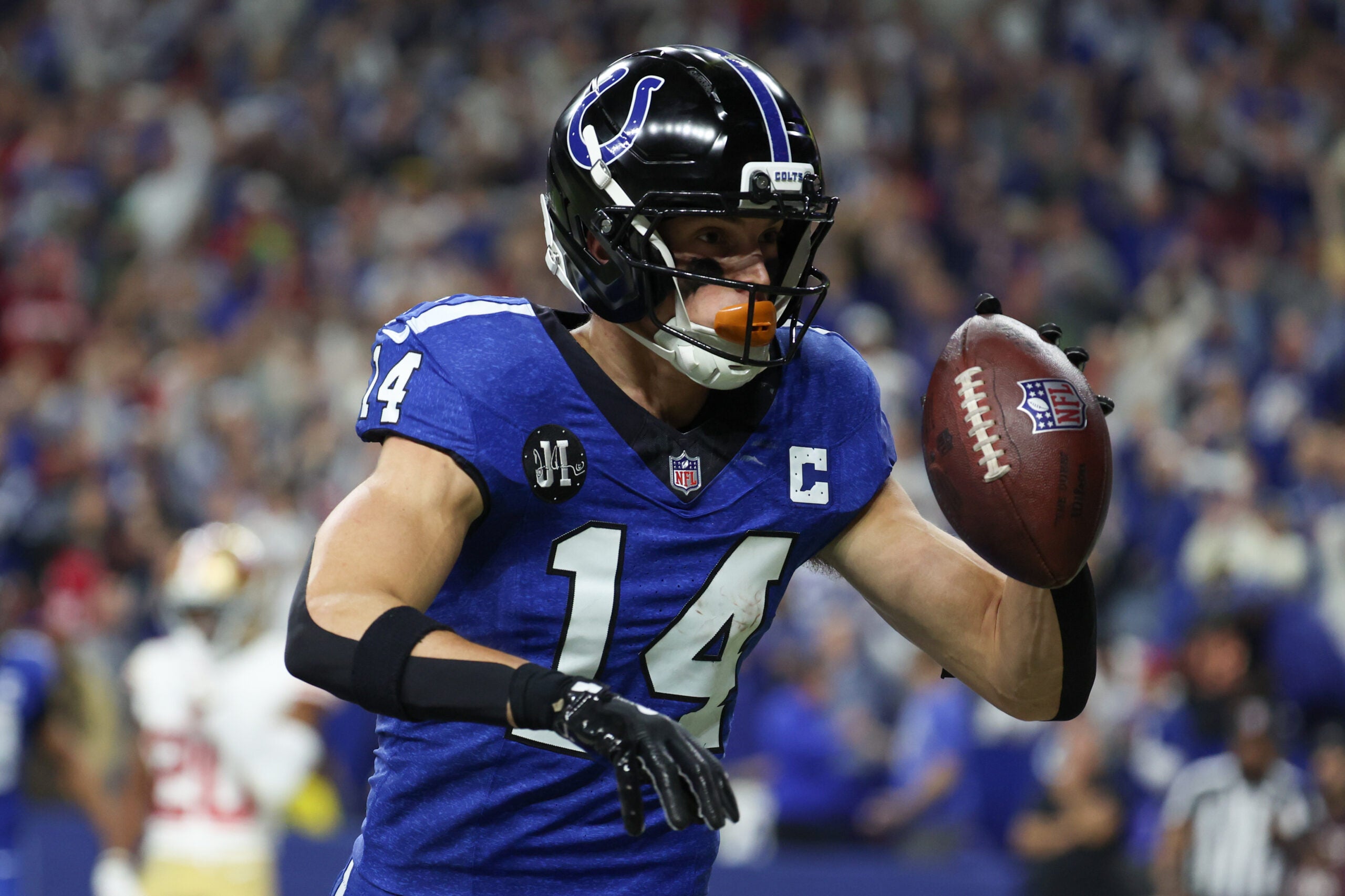 Dec 22, 2025; Indianapolis, Indiana, USA; Indianapolis Colts wide receiver Alec Pierce (14) celebrates after scoring a touchdown against the San Francisco 49ers in the second quarter of the game at Lucas Oil Stadium.