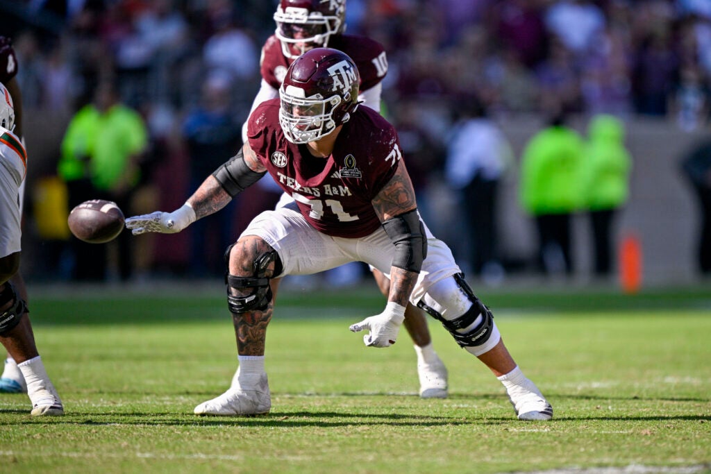 Dec 20, 2025; College Station, TX, USA; Texas A&M Aggies offensive lineman Chase Bisontis (71) blocks the rush during the game between the Aggies and the Hurricanes at Kyle Field.