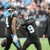 Dec 21, 2025; Charlotte, North Carolina, USA; Carolina Panthers wide receiver Tetairoa McMillan (4) throws an imaginary ball that quarterback Bryce Young (9) hits into the crowd after scoring a touchdown in the second quarter at Bank of America Stadium.