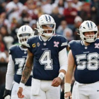Dec 25, 2025; Landover, Maryland, USA; Dallas Cowboys quarterback Dak Prescott (4) looks on during a stoppage in play against the Washington Commanders during the first half at Northwest Stadium.