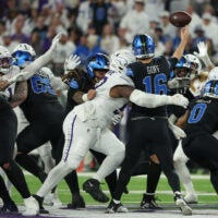 Dec 25, 2025; Minneapolis, Minnesota, USA; Minnesota Vikings defensive tackle Javon Hargrave (97) tackles Detroit Lions quarterback Jared Goff (16) in the second half at U.S. Bank Stadium.