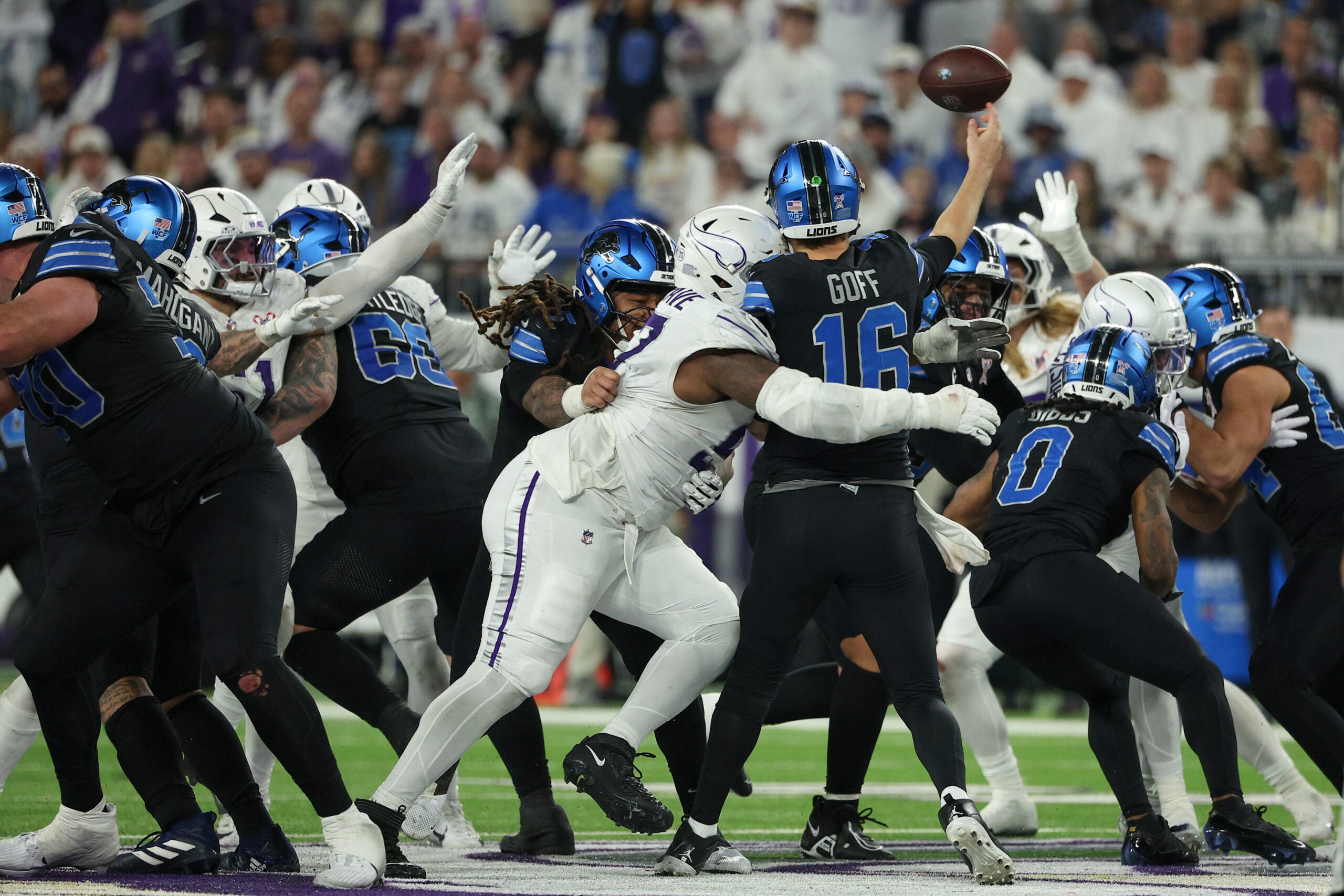 Dec 25, 2025; Minneapolis, Minnesota, USA; Minnesota Vikings defensive tackle Javon Hargrave (97) tackles Detroit Lions quarterback Jared Goff (16) in the second half at U.S. Bank Stadium.