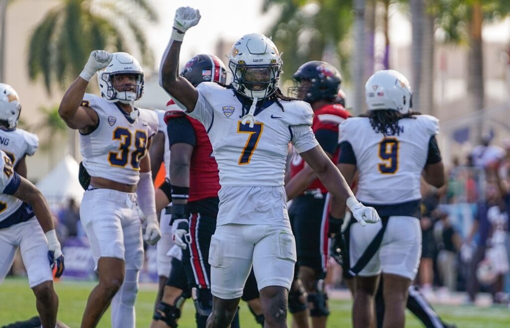 Dec 23, 2025; Boca Raton, FL, USA; Toledo Rockets safety Emmanuel McNeil-Warren (7) celebrates a third down stop against the Louisville Cardinals during the third quarter of the Boca Raton Bowl at Flagler CU Stadium.