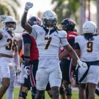 Dec 23, 2025; Boca Raton, FL, USA; Toledo Rockets safety Emmanuel McNeil-Warren (7) celebrates a third down stop against the Louisville Cardinals during the third quarter of the Boca Raton Bowl at Flagler CU Stadium.