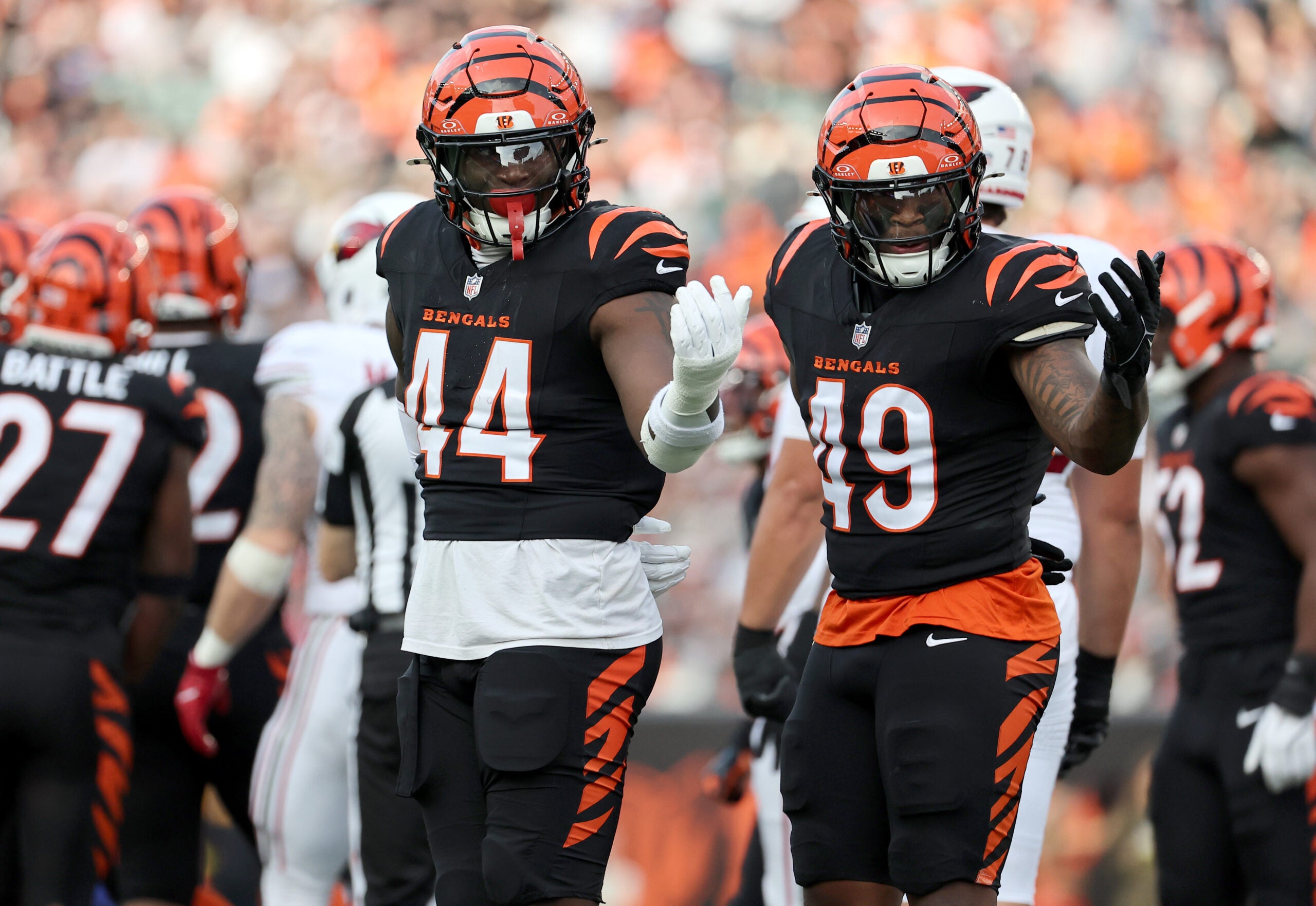 Dec 28, 2025; Cincinnati, Ohio, USA; Cincinnati Bengals linebacker Demetrius Knight Jr. (44) and Cincinnati Bengals linebacker Barrett Carter (49) react after a play during the second half against the Arizona Cardinals at Paycor Stadium.