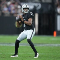 Dec 28, 2025; Paradise, Nevada, USA; Las Vegas Raiders quarterback Geno Smith (7) looks to throw in the third quarter against the New York Giants at Allegiant Stadium.