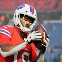 Dec 28, 2025; Orchard Park, New York, USA; Buffalo Bills wide receiver Brandin Cooks (18) warms up in the rain before the game against the Philadelphia Eagles at Highmark Stadium.