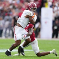 Jan 1, 2026; Pasadena, CA, USA; Alabama Crimson Tide running back Daniel Hill (4) runs against Indiana Hoosiers defensive back Devan Boykin (12) in the first half of the 2026 Rose Bowl and quarterfinal game of the College Football Playoff at Rose Bowl Stadium.