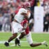 Jan 1, 2026; Pasadena, CA, USA; Alabama Crimson Tide running back Daniel Hill (4) runs against Indiana Hoosiers defensive back Devan Boykin (12) in the first half of the 2026 Rose Bowl and quarterfinal game of the College Football Playoff at Rose Bowl Stadium.