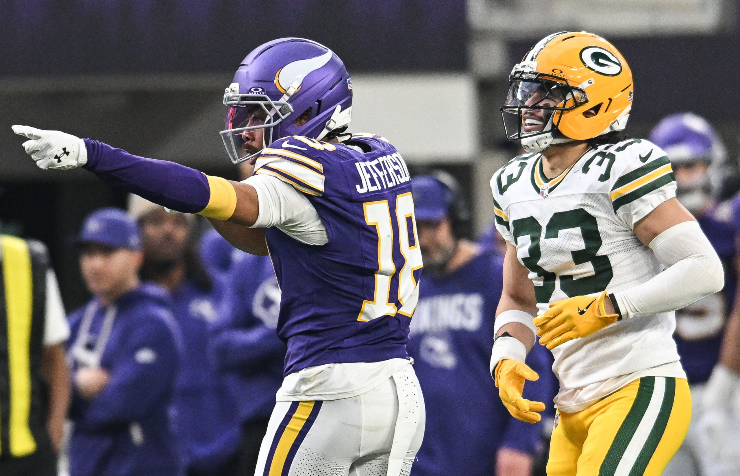 Jan 4, 2026; Minneapolis, Minnesota, USA; Minnesota Vikings wide receiver Justin Jefferson (18) celebrates after a play in front of Green Bay Packers safety Evan Williams (33) during the second quarter at U.S. Bank Stadium.