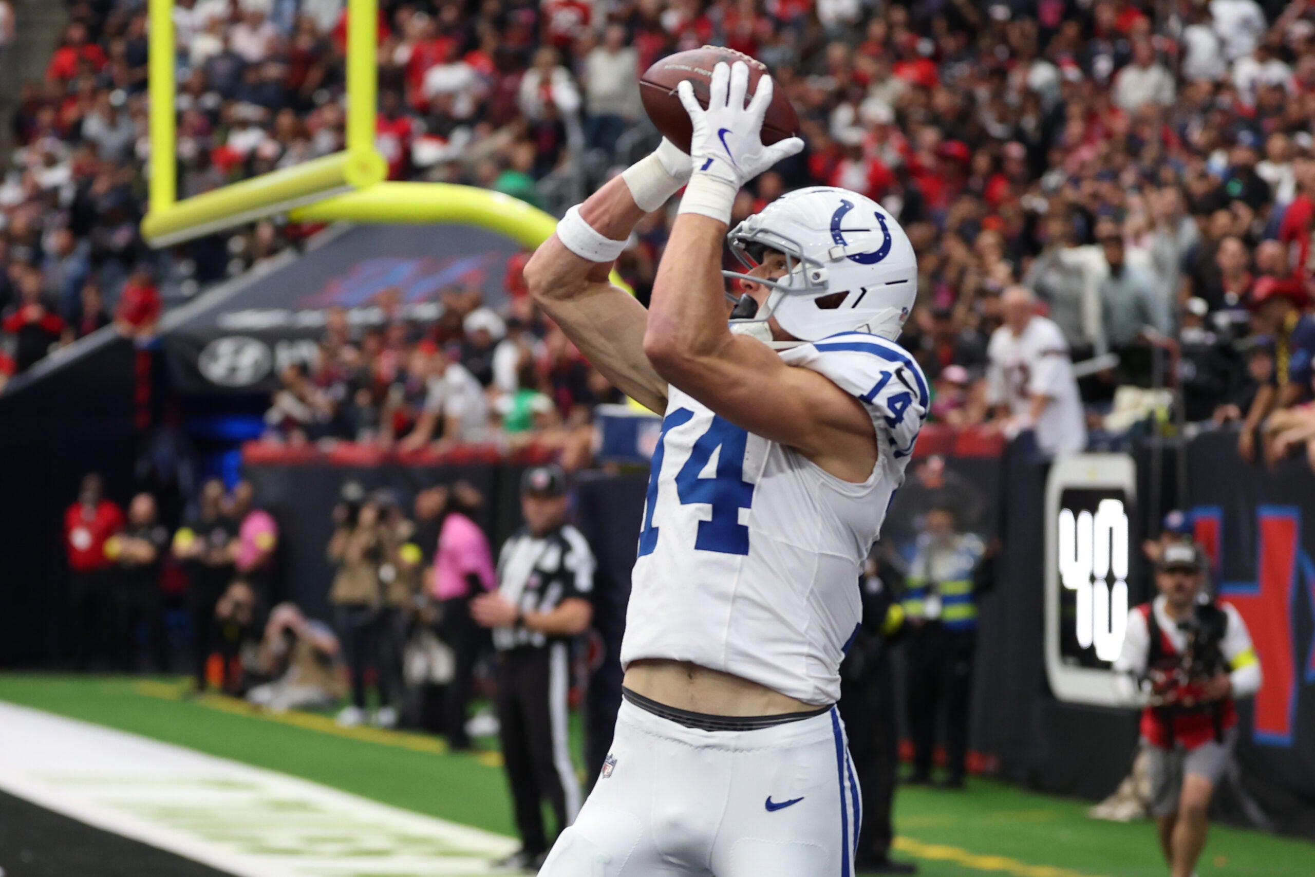 Jan 4, 2026; Houston, Texas, USA; Indianapolis Colts wide receiver Alec Pierce (14) catches a touchdown pass against the Houston Texans during the first half at NRG Stadium.