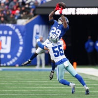 Jan 4, 2026; East Rutherford, New Jersey, USA; Dallas Cowboys linebacker Logan Wilson (55) breaks up a pass intended for New York Giants running back Tyrone Tracy Jr. (29) during the fourth quarter at MetLife Stadium.