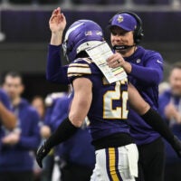 Jan 4, 2026; Minneapolis, Minnesota, USA; Minnesota Vikings head coach Kevin O'Connell greets Minnesota Vikings safety Harrison Smith (22) against the Green Bay Packers during the fourth quarter at U.S. Bank Stadium.