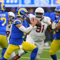 Jan 4, 2026; Inglewood, California, USA; Los Angeles Rams quarterback Matthew Stafford (9) is pressured by Arizona Cardinals defensive end L.J. Collier (91) during the first half at SoFi Stadium.