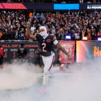 Jan 4, 2026; Chicago, Illinois, USA; Chicago Bears wide receiver DJ Moore (2) runs onto the field before the game between the Chicago Bears and the Detroit Lions at Soldier Field.