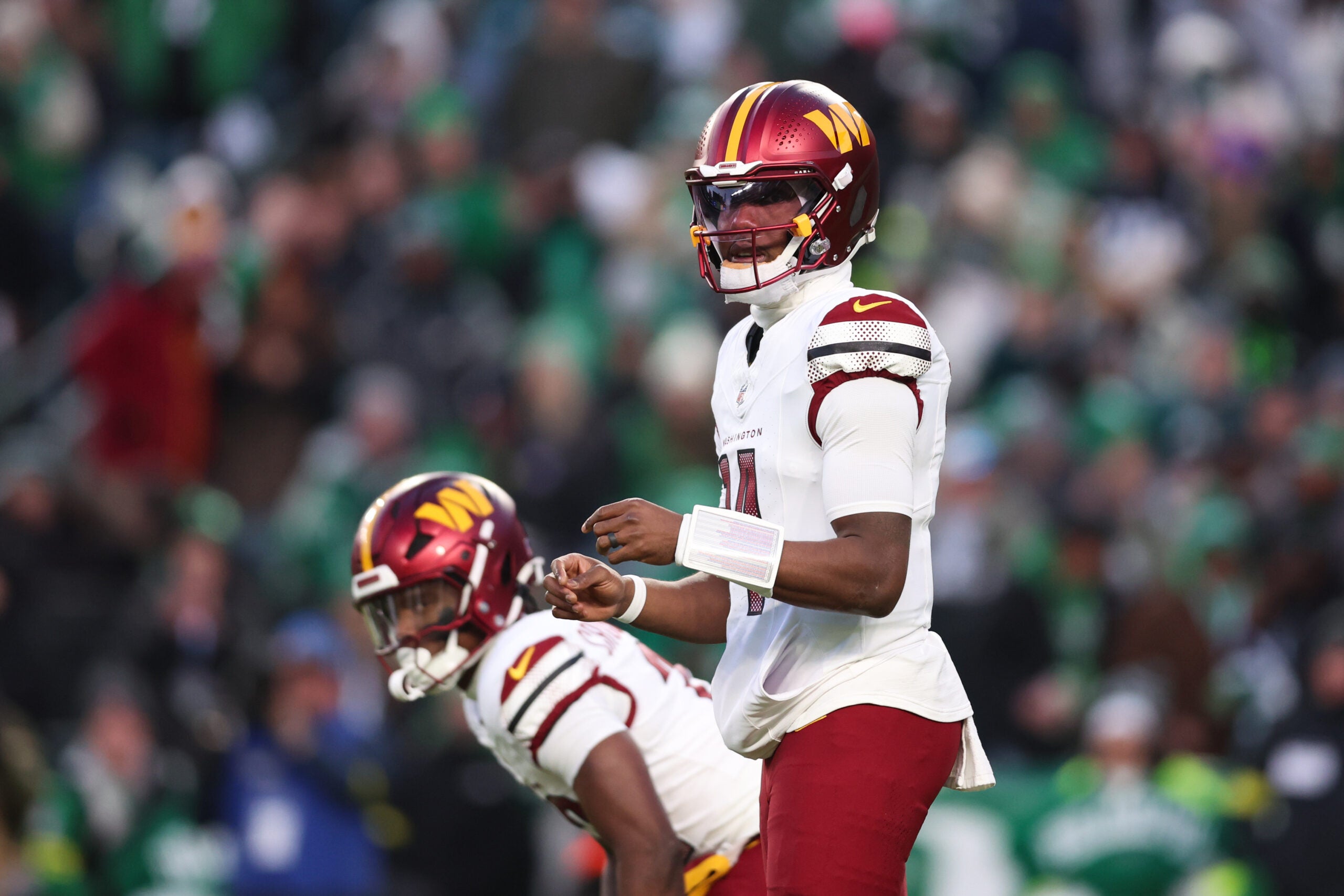 Jan 4, 2026; Philadelphia, Pennsylvania, USA; Washington Commanders quarterback Josh Johnson (14) prepares to take a snap during the second quarter against the Philadelphia Eagles at Lincoln Financial Field.