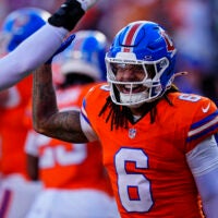 Jan 4, 2026; Denver, Colorado, USA; Denver Broncos safety P.J. Locke (6) smiles during the first half against the Los Angeles Chargers at Empower Field at Mile High.