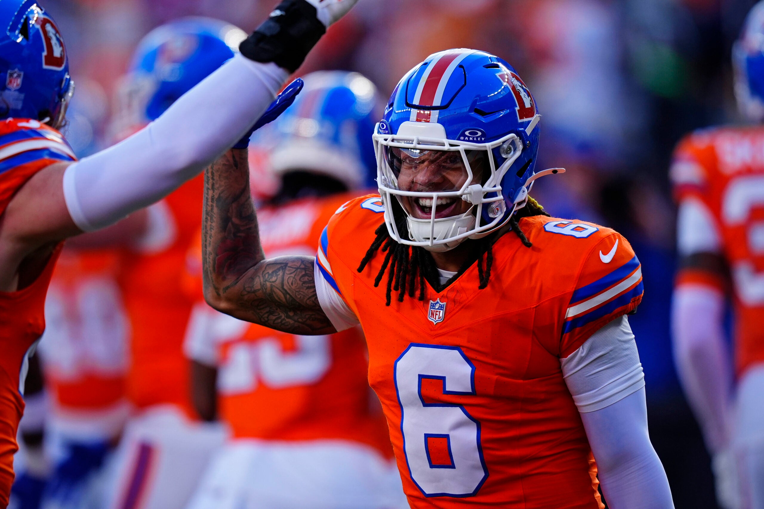 Jan 4, 2026; Denver, Colorado, USA; Denver Broncos safety P.J. Locke (6) smiles during the first half against the Los Angeles Chargers at Empower Field at Mile High.