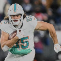 Jan 4, 2026; Foxborough, Massachusetts, USA; Miami Dolphins tight end Greg Dulcich (85) runs after the catch against against the New England Patriots during the third quarter at Gillette Stadium.