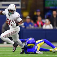Jan 4, 2026; Inglewood, California, USA; Arizona Cardinals running back Emari Demercado (31) carries the ball as Los Angeles Rams cornerback Emmanuel Forbes Jr. (1) defends during the second half at SoFi Stadium.