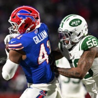 Jan 4, 2026; Orchard Park, New York, USA; Buffalo Bills fullback Reggie Gilliam (41) makes a catch defended by New York Jets linebacker Quincy Williams (56) during the second quarter at Highmark Stadium.