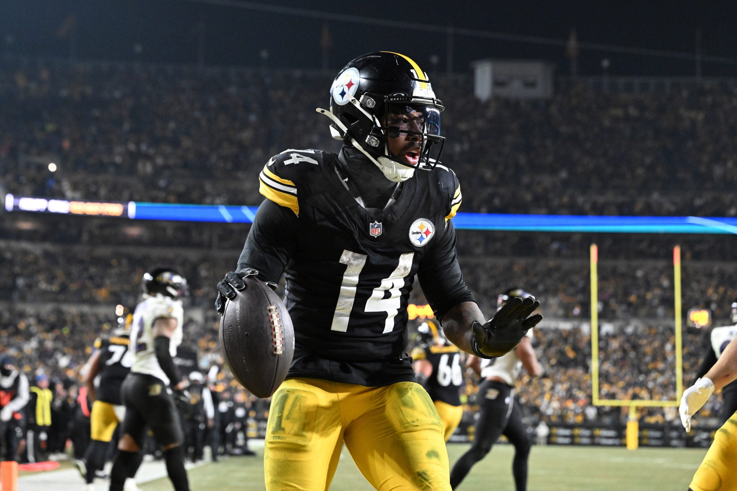Jan 4, 2026; Pittsburgh, Pennsylvania, USA; Pittsburgh Steelers running back Kenneth Gainwell (14) rushes for a touchdown against the Baltimore Ravens during the second half at Acrisure Stadium.