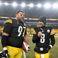 Jan 4, 2026; Pittsburgh, Pennsylvania, USA; Pittsburgh Steelers defensive tackle Cameron Heyward (97) and quarterback Aaron Rodgers (8) celebrate after defeating the Baltimore Ravens at Acrisure Stadium.