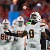 Miami Hurricanes defensive back Keionte Scott (0) runs onto the field at the start of the CFP Fiesta Bowl against Ole Miss at the State Farm Stadium, in Glendale, Ariz., on Thursday, Jan. 8, 2026.