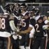 Jan 10, 2026; Chicago, IL, USA; Chicago Bears quarterback Caleb Williams (18) and wide receiver DJ Moore (2) react after hooking up on the eventually game winning touchdown against the Green Bay Packers during the second half of an NFC Wild Card Round game at Soldier Field.