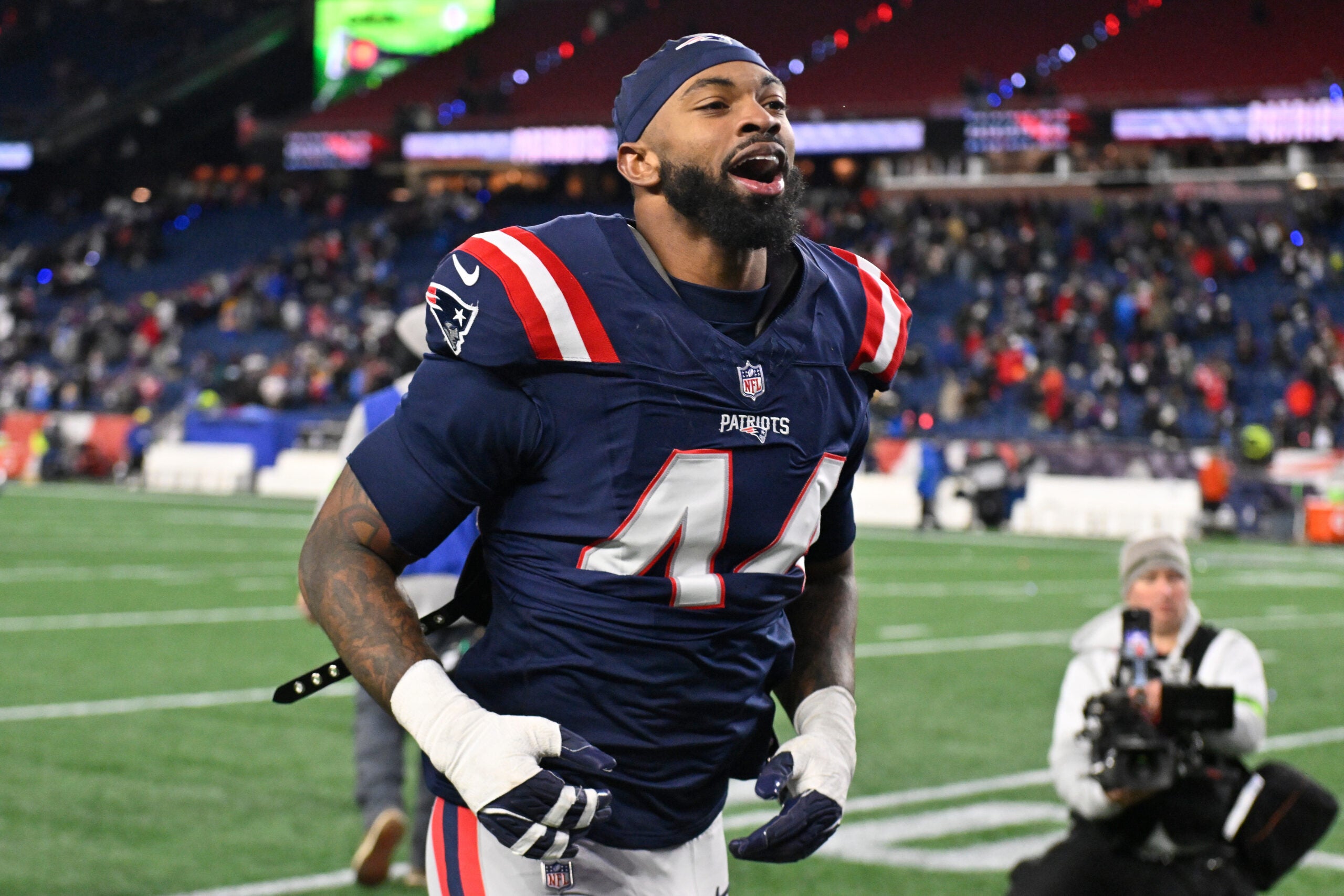 Jan 11, 2026; Foxborough, MA, USA; New England Patriots linebacker K'Lavon Chaisson (44) jogs off the field after defeating the Los Angeles Chargers in an AFC Wild Card Round game at Gillette Stadium.