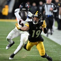 Jan 12, 2026; Pittsburgh, PA, USA; Pittsburgh Steelers wide receiver Calvin Austin III (19) reaches for an incomplete pass against Houston Texans cornerback Kamari Lassiter (4) during the second half of an AFC Wild Card Round game at Acrisure Stadium.