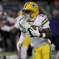 Green Bay Packers wide receiver Jayden Reed (11) runs the ball during the first quarter of their wild card playoff game against the Chicago Bears Saturday, January 10, 2026 at Soldier Field in Chicago, Illinois.