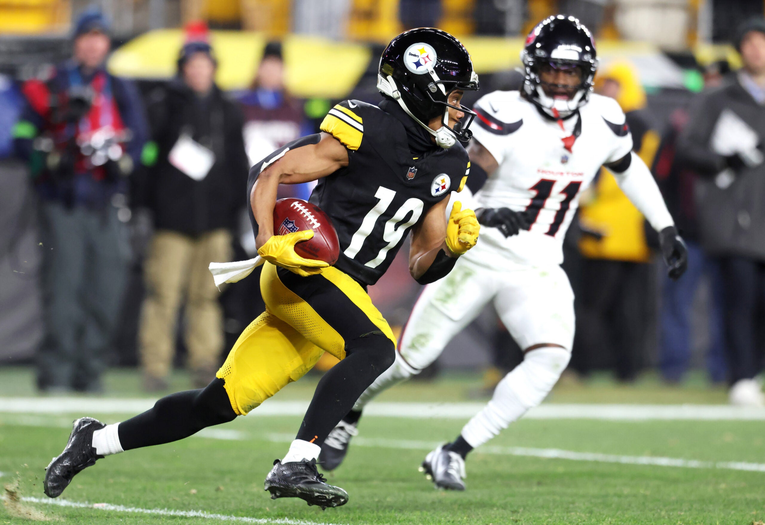 Jan 12, 2026; Pittsburgh, PA, USA; Pittsburgh Steelers wide receiver Calvin Austin III (19) runs against Houston Texans cornerback Tremon Smith (11) during the second half of an AFC Wild Card Round game at Acrisure Stadium.