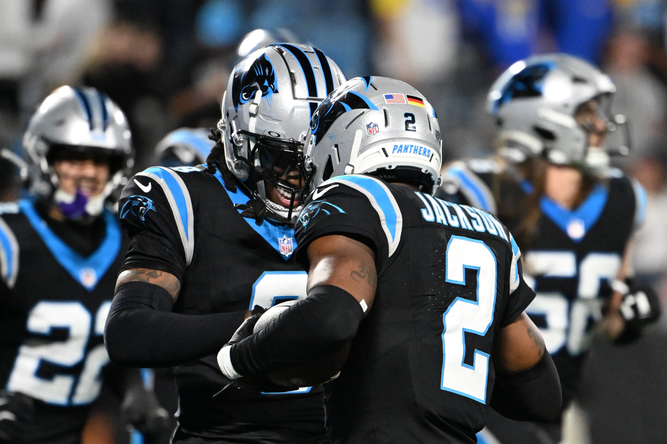 Jan 10, 2026; Charlotte, NC, USA; Carolina Panthers cornerback Mike Jackson (2) and cornerback Jaycee Horn (8) react in the fourth quarter in an NFC Wild Card Round game at Bank of America Stadium.