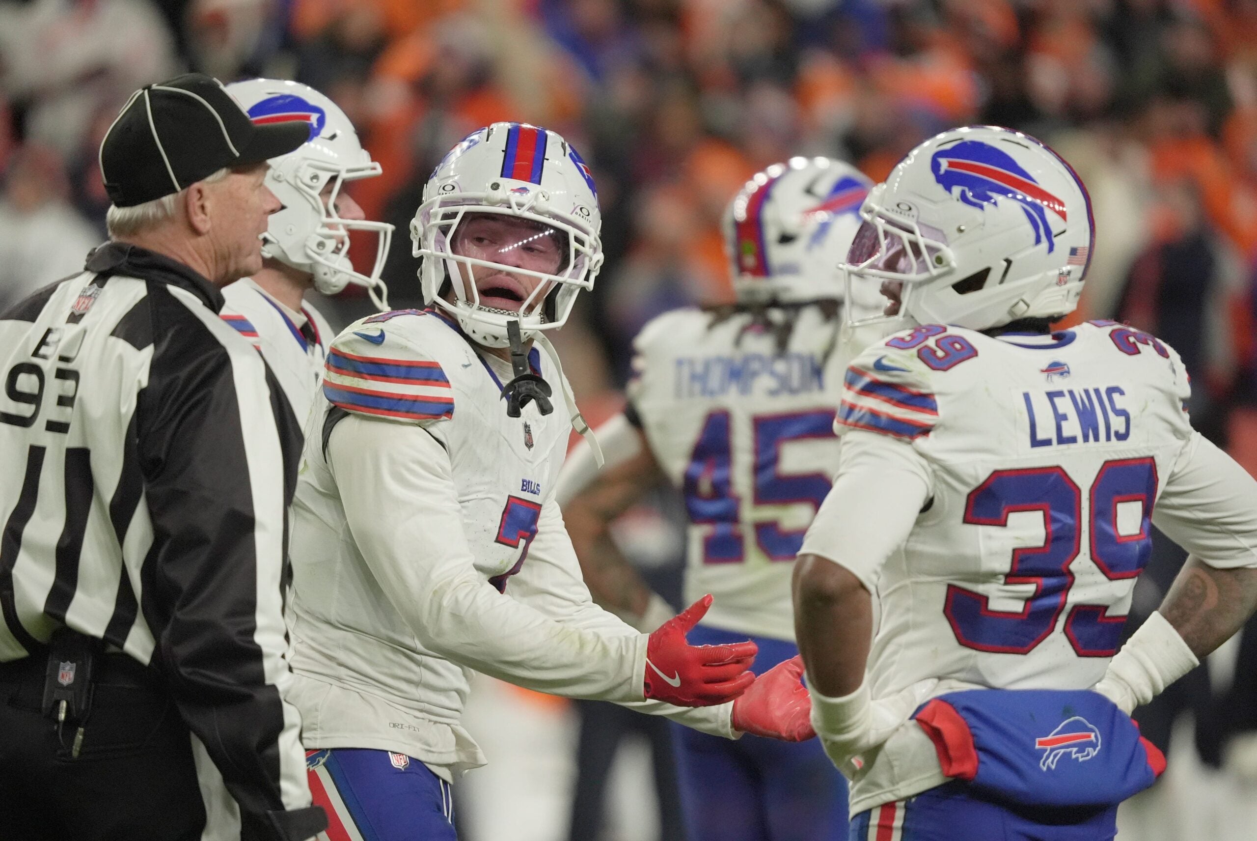 Buffalo Bills cornerback Taron Johnson argues the call for holding with back judge Scott Helverson during overtime at Empower FIeld at Mile High in Denver, Colorado on Jan. 17, 2026.