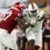 Jan 19, 2026; Miami Gardens, FL, USA; Indiana Hoosiers offensive lineman Kahlil Benson (67) attempts to block Miami Hurricanes defensive lineman Rueben Bain Jr. (4) in the first half during the College Football Playoff National Championship game at Hard Rock Stadium.