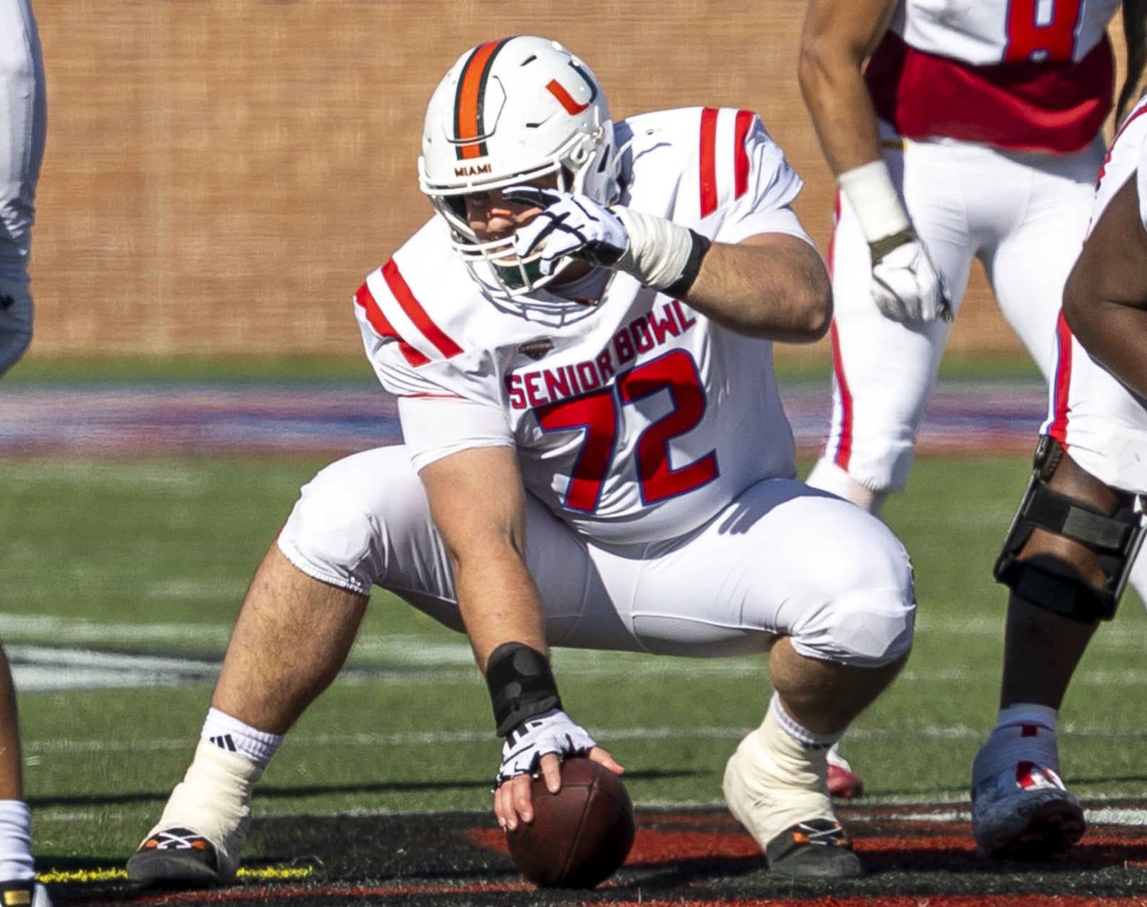 Jan 31, 2026; Mobile, AL, USA; American offensive lineman James Brockermeyer (72) of Miami signals during the first half of the 2026 Senior Bowl at University of South Alabama, Hancock Whitney Stadium.
