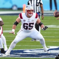 Feb 8, 2026; Santa Clara, CA, USA; New England Patriots center Garrett Bradbury (65) blocks against the Seattle Seahawks during the first quarter in Super Bowl LX at Levi's Stadium.